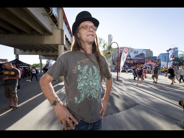 Jay Lino proudly sports his 21-year-old Tragically Hip T-shirt before a Tragically Hip concert at the Scotiabank Saddledome in Calgary, Alta., on Monday, Aug. 1, 2016. The show was part of the iconic band's final tour, happening in the wake of Downie's incurable brain cancer diagnosis. Lyle Aspinall/Postmedia Network