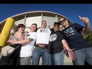 Julie Foster, Steve Morrison, Gord Larson, Don Clutterham and Bree Nicholl mug for a photo before a Tragically Hip concert at the Scotiabank Saddledome in Calgary, Alta., on Monday, Aug. 1, 2016. The show was part of the iconic band's final tour, happening in the wake of Downie's incurable brain cancer diagnosis. Lyle Aspinall/Postmedia Network