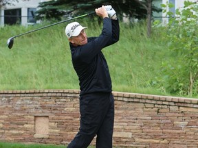 Bob Niger tees off on the first hole of the Shaw Charity Classic Pre-qualifying tournament at the Hamptons Golf Club in Calgary on Aug. 21, 2014.