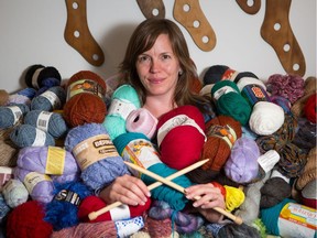 Veronica Murphy, owner of STASH yarns, accessories, and classes, poses with the hundreds of spools of yarn she collected in a donation call out to help lift the spirits of Fort McMurray citizens.