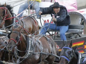 Luke Tournier pushes out of the opening barrels in a heat in the chuckwagon derby at Calgary Stampede.