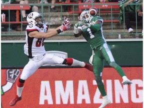 Ottawa Redblacks wide receiver Greg Ellingson and Saskatchewan Roughriders defensive back Buddy Jackson go up for the ball during first half CFL action in Regina on Friday, July 22, 2016.