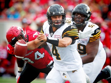 Hamilton Tiger-Cats quarterback Zach Collaros looks to throw a pass during a game against the Calgary Stampeders in Calgary, Alta., on Sunday, August 28, 2016. AL CHAREST/POSTMEDIA