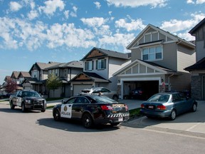 Police at the scene of an overnight home invasion on Panamount Common NW in Calgary, Ab., on Friday August 5, 2016.