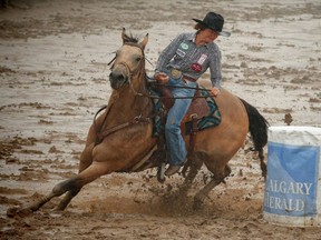 Oklahoma cowgirl Mary Burger wins the $100,000 in the barrel-racing event during the final day of the rodeo at the Calgary Stampede on Sunday, July 17, 2016. AL CHAREST/POSTMEDIA