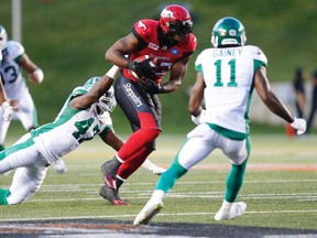 Calgary Stampeders Jerome Messam carries the ball against the Saskatchewan Roughriders during CFL action in Calgary on Aug. 4, 2016.