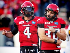 Calgary Stampeders Drew Tate celebrates with kicker Rene Paredes after a 45-yard field goal against the Hamilton Tiger-Cats during CFL football in Calgary, Alta., on Sunday, August 28, 2016.