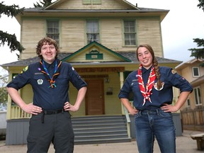 Robert Marshall (L) and Nicole Doran, both Venture Scouts with the 31st St Cyprian's in northwest Calgary, pose in front of their historic hall on Wednesday, Aug. 17. The pair of 17-year-old Scouts from Calgary travelled to Finland and joined over 15,000 Scouts from around the world to take part in the 7th annual International Roihu Finnjamboree.