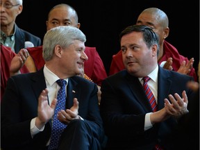 In this file photo, former PM Stephen Harper speaks with former Calgary MP Jason Kenney in Markham, Ontario, on Monday, August 10, 2015.