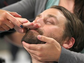 Herald reporter Michael Lumsden participates in a body control demonstration at the CPS headquarters