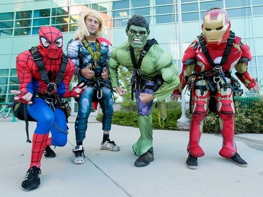 Spiderman, Thor, the Hulk and Ironman strike a pose between window-washing sets at the Alberta Children's Hospital in Calgary, Alta., on Wednesday, Aug. 24, 2016. The washers refused to identify their secret identities, opting instead to wow kids through windows while cleaning the hospital's exterior.