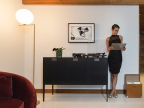 woman looking through LP collection