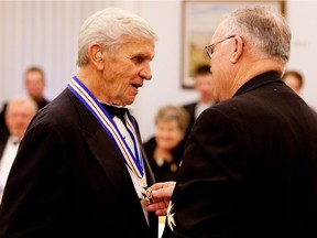 William Mooney, left, receives his Alberta Order of Excellence award at an Oct. 20, 2010 ceremony in Edmonton.