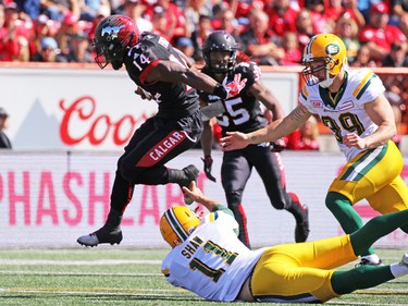 Calgary Stampeders running back Roy Finch runs for a touch down after an Edmonton Eskimos fumbled kick return in the first half of the CFL Labour Day Classic in Calgary on Monday September 5, 2016.