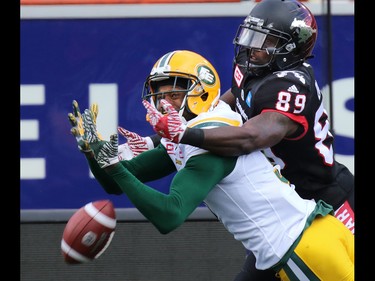 Calgary Stampeders receiver DaVaris Daniels collides with Edmonton Eskimos Patrick Watkins during the second half of the CFL Labour Day Classic in Calgary on Monday September 5, 2016.