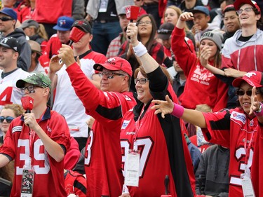 Calgary Stampeders fans cheer on their team during the CFL Labour Day Classic in Calgary on Monday September 5, 2016.
