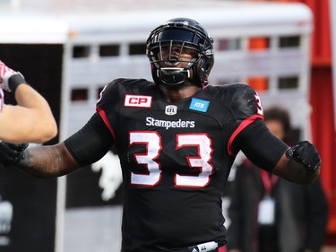Calgary Stampeders running back Jerome Messam celebrates his touch down late in the fourth quarter with  during the CFL Labour Day in Classic Calgary on Monday September 5, 2016.
