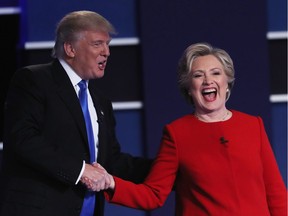 Republican presidential nominee Donald Trump and Democratic presidential nominee Hillary Clinton shake hands.