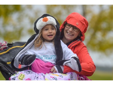 Vickie Naish, a survivor, laughs with her granddaughter Emma at the Ovarian Cancer Walk of Hope in Calgary, Alta., on Sunday, Sept. 11, 2016. Elizabeth Cameron/Postmedia