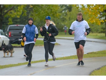 Participants on their final leg of the Ovarian Cancer Walk of Hope at North Glenmore Park in Calgary, Alta., on Sunday, Sept. 11, 2016. Elizabeth Cameron/Postmedia