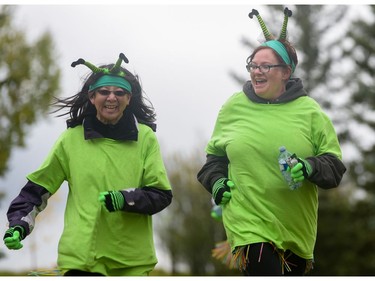 Members of 'The Fighting Kelley's' finish the Ovarian Cancer Walk of Hope at North Glenmore Park in Calgary, Alta., on Sunday, Sept. 11, 2016. Elizabeth Cameron/Postmedia