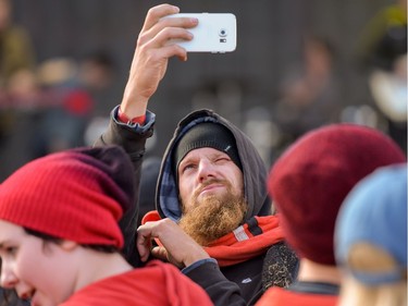 A man snaps a selfie during Atlas Genius' performance at X-Fest 2016 in Calgary, Alta., on Sunday, Sept. 4, 2016.