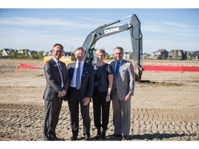 Wallace Chow, vice-president of development for Jayman Built Multi-Family; Jay Westman, chairman and CEO of Jayman Built; Lisa Feist, vice-president of sales and marketing for Jayman Built Multi-Family, Larry Noer, executive vice-president of Jayman Built Multi-Family at the site where construction is now underway for Westman Village.