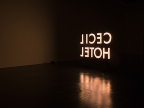 The Cecil Hotel sign glows at the exhibition at Truck Contemporary Art in Calgary.