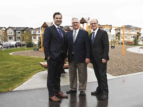 Ward 3 Coun. Jim Stevenson, centre, joins Genstar Development Co.'s Paul Boscovich, left, and Marcello Chiacchia at the grand opening of the new community of Savanna in Saddle Ridge.