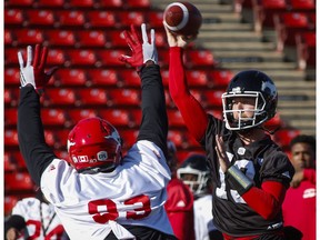 Calgary Stampeders quarterback Bo Levi Mitchell, right, throws the ball during a team practice in Calgary, Thursday, Sept. 29, 2016.