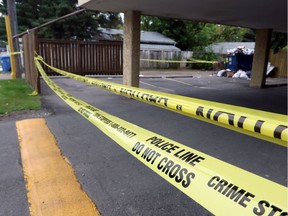 Calgary Police remained at the scene of a fatal stabbing on Bowness Road on Sept. 2, 2014.