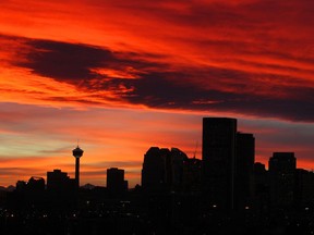 The temperature will drop slightly on Tuesday night to -2 C, but the mercury will be rising again on Wednesday to 8 C before reaching double digits on Thursday. A chinook arch and a spectacular sunset combined for a beautiful evening with the Calgary skyline along the Bow River on Tuesday Nov. 26, 2013. (Gavin Young/Calgary Herald)