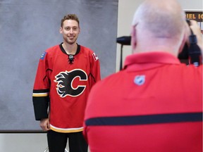 Calgary Flames goaltender Chad Johnson has his photo taken by Calgary Flames photographer Brad Watson before fitness testing at WinSport on the first day of team training camp Thursday Sept. 22, 2016.  Gavin Young/Postmedia