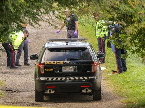 Calgary Police at the scene where a body was found around 5:30 a.m. in an alley near 46 Street and 17 Avenue S.W. in Calgary, Ab., on Saturday, Sept. 3, 2016.