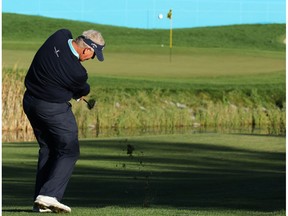 Colin Montgomerie hits towards the 18th green duriing round 1 of the Shaw Charity Classic at the Canyon Meadows Golf Club in Calgary on Friday September 2, 2016.