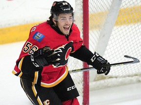 Calgary Flames' Ryan Lomberg (56) celebrates his game winning overtime goal against the Vancouver Canucks during third period 2016 NHL Young Stars Classic action at the South Okanagan Events Centre in Penticton, B.C., on Sept. 19, 2016.