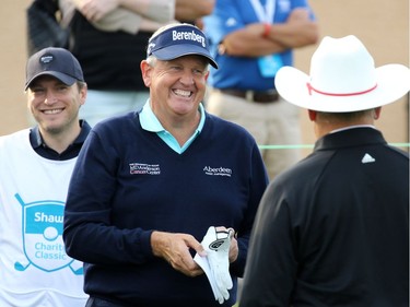 Golfer Colin Montgomerie laughs with fellow players before the start of the Shaw Classic RBC Championship ProAm event at the Canyon Meadows Golf Club on Wednesday August 31, 2016.