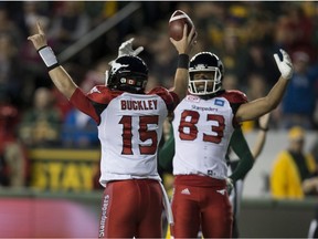 Calgary Stampeders quarterback Andrew Buckley (15) celebrates a touchdown with teammate Juwan Brescacin (83) in overtime against the Edmonton Eskimos on Saturday, September 10, 2016 in Edmonton. Greg  Southam / Postmedia  (To go with sports story) Photos for stories, columns off Eskimos game appearing in Sunday, Sept. 11 edition.