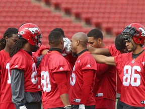 Calgary Stampeders receiving corp gather together near the end of practice at McMahon Stadium in Calgary, Alta. on Thursday September 29, 2016. The team plays against the Hamilton Tiger Cats on Saturday. Jim Wells/Postmedia