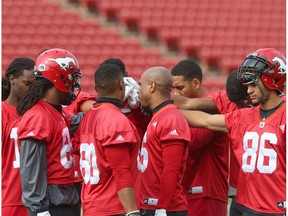 Calgary Stampeders receiving corp gather together near the end of practice at McMahon Stadium in Calgary, Alta. on Thursday September 29, 2016. The team plays against the Hamilton Tiger Cats on Saturday.