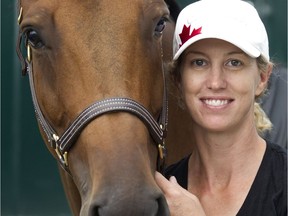 Canadian rider Amy Millar poses with her horse Heros in the Spruce Meadows barns Friday September 9, 2016 during The Masters.