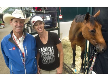 Canadian rider Amy Millar poses with dad, riding legend Ian Millar, and her horse Heros in the Spruce Meadows barns Friday September 9, 2016 during The Masters.