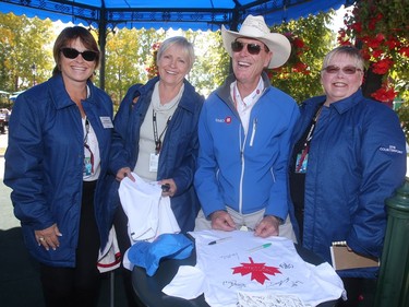 Canadian legend Ian Millar poses with the winner of the Name The Foal contest, from left, Lisa Mander of Ladner, BC, Lorraine Fletcher of Port Ryerse, Ontario, and Diane Irwin of Caledon, Ontario during an autograph session Friday September 9, 2016 at Spruce Meadows during The Masters.