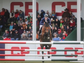 British rider Scott Brash clears a fence on his way to victory in the CP International Grand Prix, and it's $1million paycheque, Sunday September 11, 2016 on the final day of the Spruce Meadows Masters.