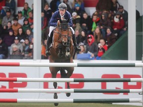 British rider Scott Brash clears a fence on his way to victory in the CP International Grand Prix, and it's $1million paycheque, Sunday September 11, 2016 on the final day of the Spruce Meadows Masters. (Ted Rhodes/Postmedia)