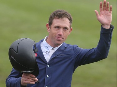 British rider Scott Brash waves to the crowd after winning cheque Sunday September 11, 2016 on the final day of the Spruce Meadows Masters.