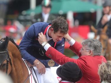 British rider Scott Brash receives his gold medal after winning the CP International Grand Prix and it's $1million paycheque Sunday September 11, 2016 on the final day of the Spruce Meadows Masters.