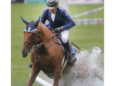 Egyptian rider Sameh El Dahan and his mount Sumas Zorro land in the water on the triple jump which gave many riders trouble during the CP International Grand Prix Sunday September 11, 2016 on the final day of the Spruce Meadows Masters.