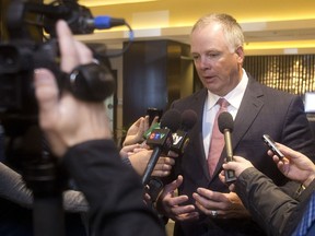 Calgary Police Chief Roger Chaffin addresses a media scrum. (Ted Rhodes/Postmedia Calgary)