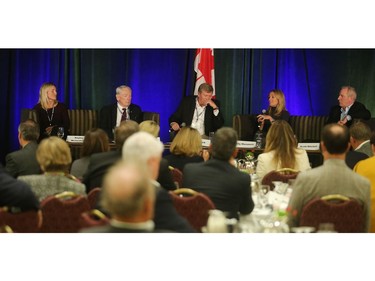 Broadcaster Tom Clark, centre, moderates during The Future of Sports panel, with, from left, Olympic hockey medalist Hayley Wickenheiser, IOC member Dick Pound, Tennis Canada president Kelly Murumets and Tiger Cat CEO Scott Mitchell, Friday September 30, 2016 at the Banff Springs Hotel.